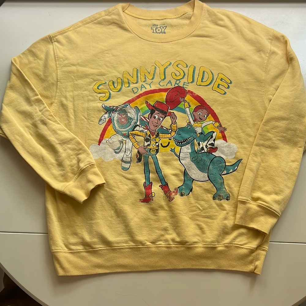 Disney Women’s Yellow Toy Story Sunnyside Daycare Sweatshirt